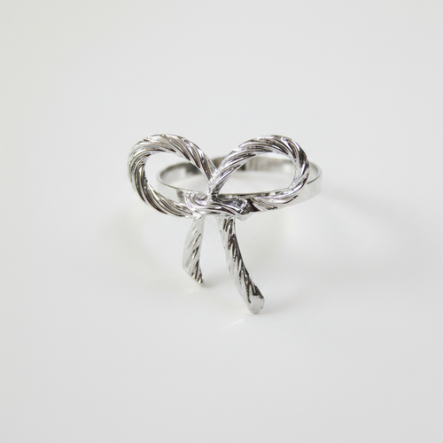 Close-up of silver metal rope bow tie napkin ring detail