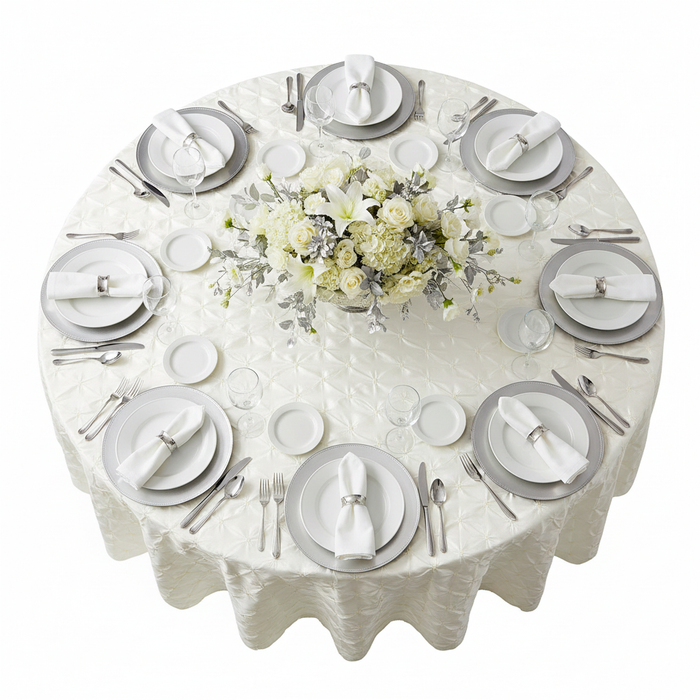 120" Pinchwheel Round Tablecloth - Ivory with silver charger plate | white dinner plate | white napkin | wine goblets | flower centerpiece