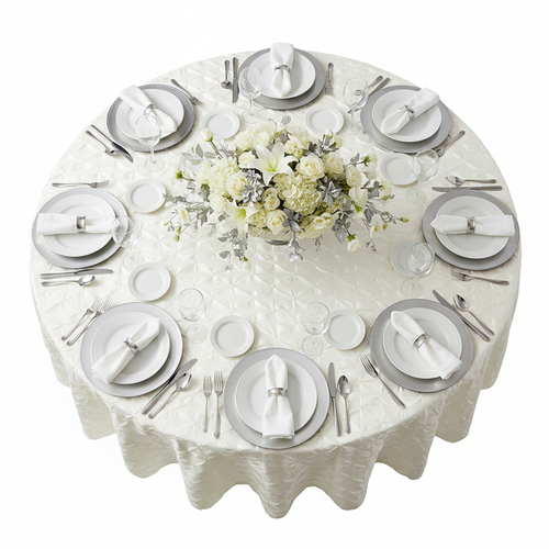 120" Pinchwheel Round Tablecloth - Ivory with silver charger plate | white dinner plate | white napkin | wine goblets | flower centerpiece