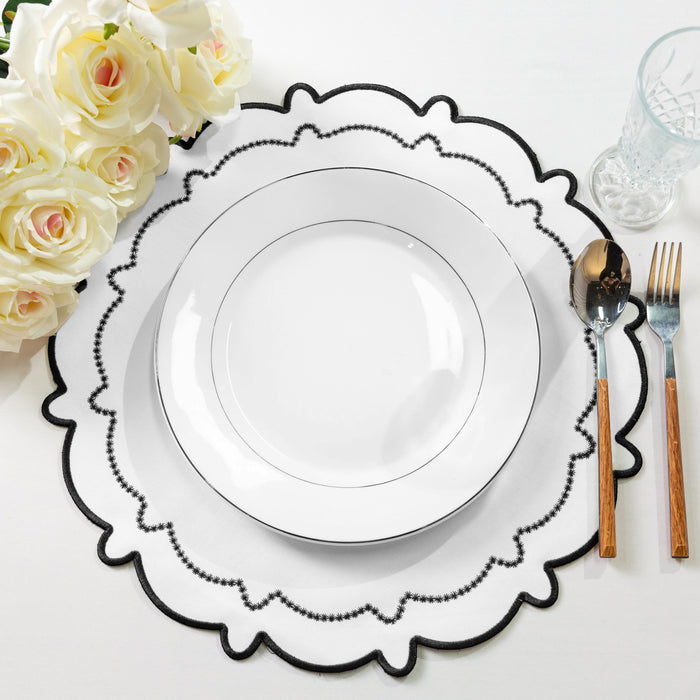 4pc/set Signature Scallop Placemats - White/Black Trim with white dinner plate, ivory roses, and silverware