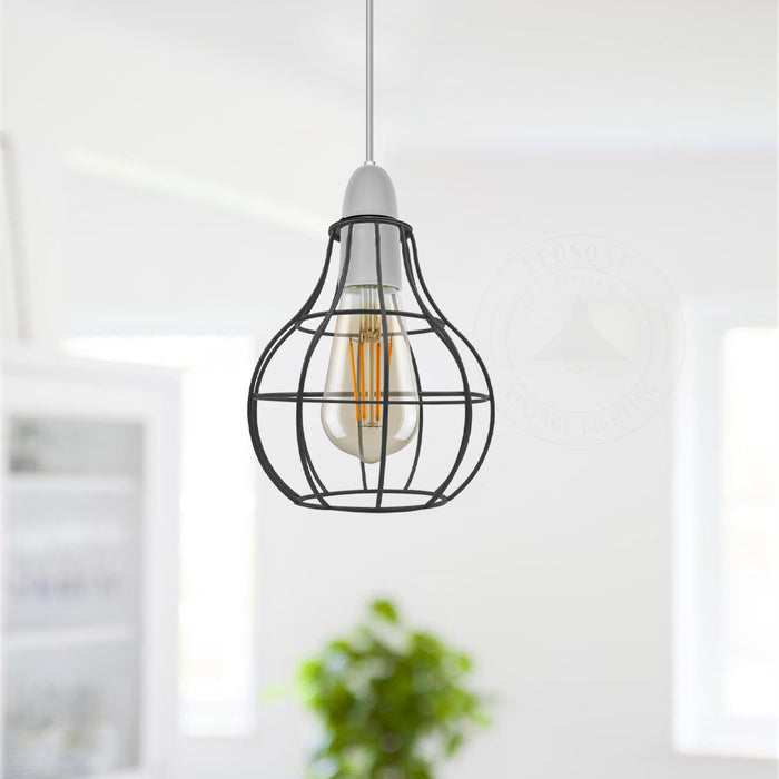 Vintage style black wire light guard hanging in a modern kitchen or living room setting