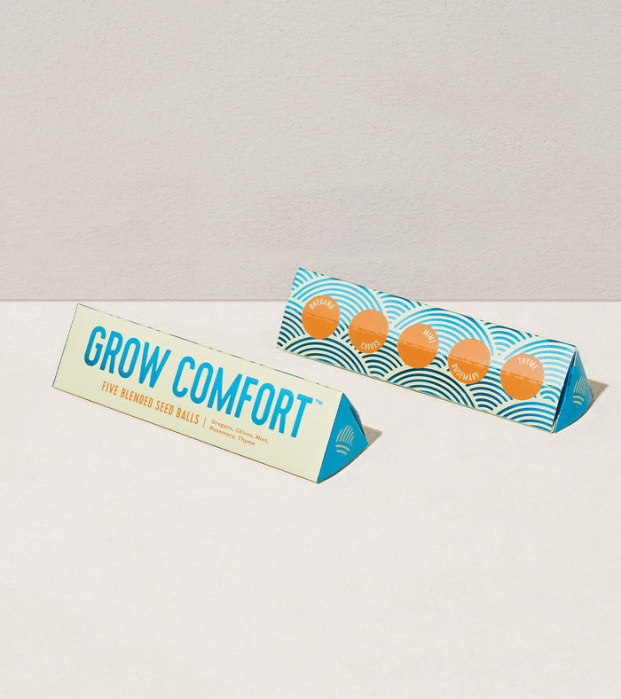 Bright Side Seed Balls packaging featuring "Grow Comfort" label and colorful design, showcasing five blended seed balls.