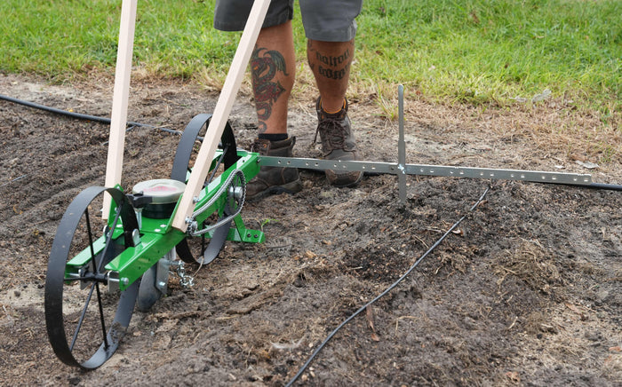 Garden Seeder Row Maker in use