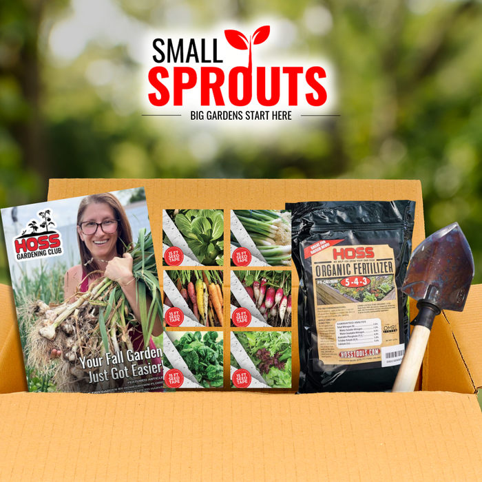 Open Small Sprouts subscription box featuring six fall seed varieties, Hoss Organic Fertilizer, a garden trowel, and a Hoss Gardening Club fall gardening guide.