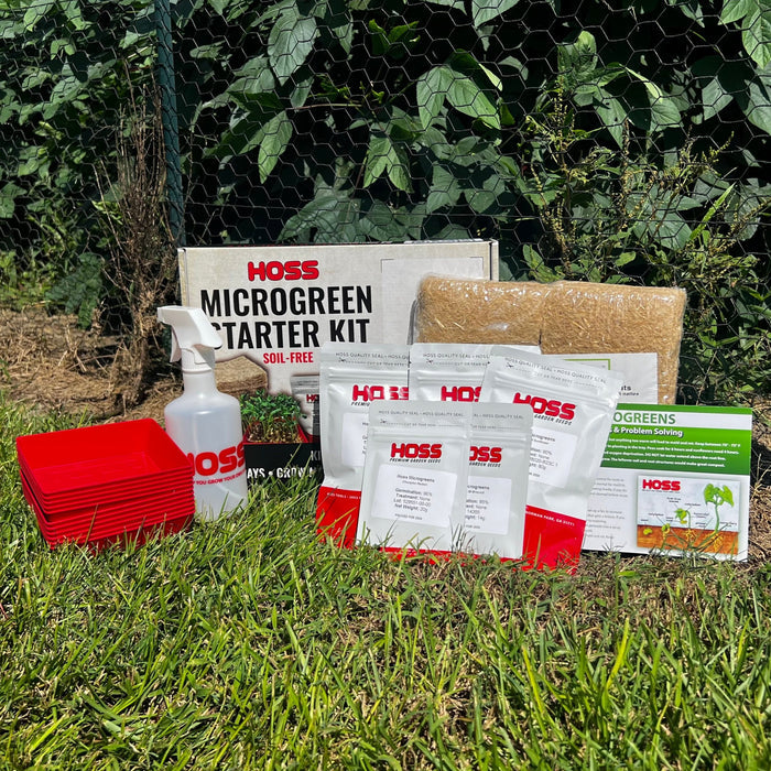 Hoss Microgreen Starter Kit with various components on grass