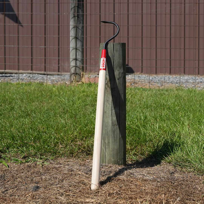 Short Single Tine Cultivator leaned on a post